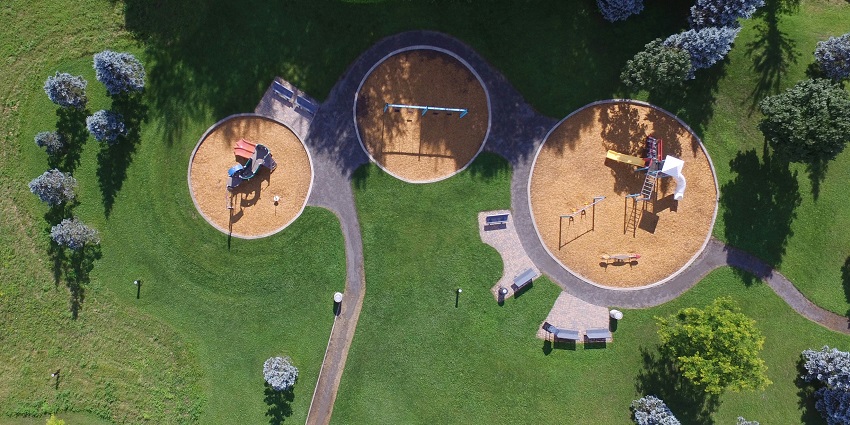 A bird's-eye view of wonderland theme park, showcasing urban landscapes, and greenery