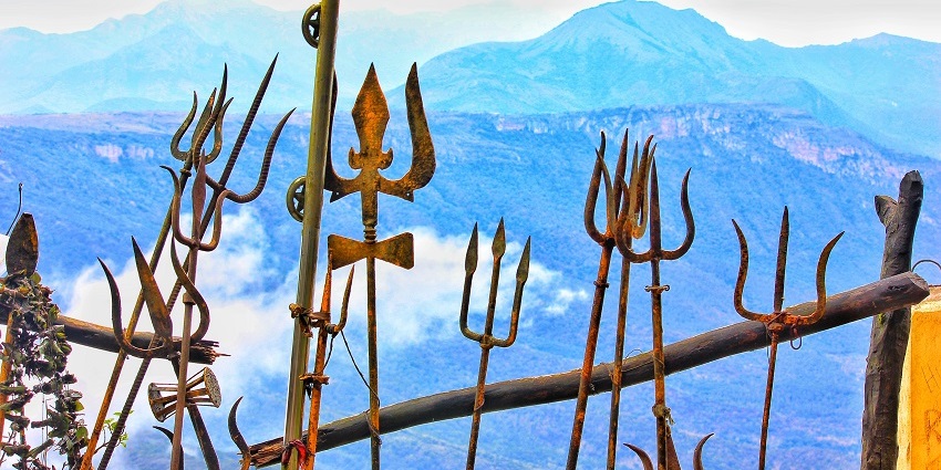 Various trishuls’ of Lord Shiva set against a boundary of the Dhyanalinga Temple.