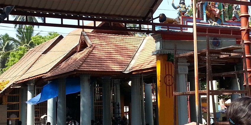 Ancient Mondaikkadu Temple in Tamil Nadu featuring intricate architecture, lush surroundings