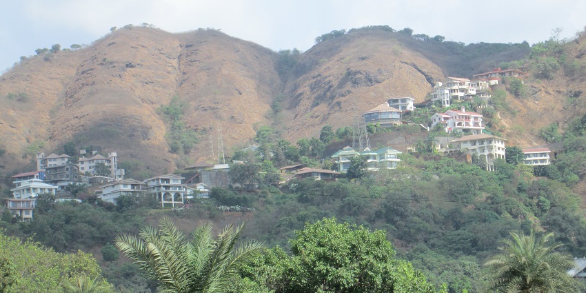 A view of green hills by train, a popular tourist attraction near Padargad Fort.