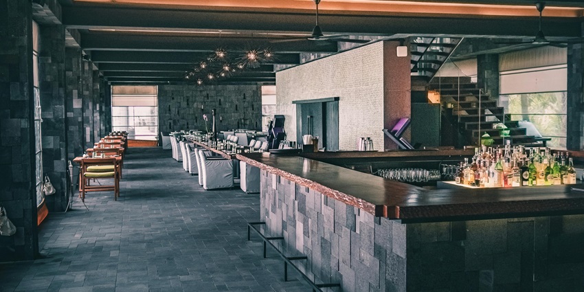 Modern restaurant interior with elegant seating and dark-toned stylish decor