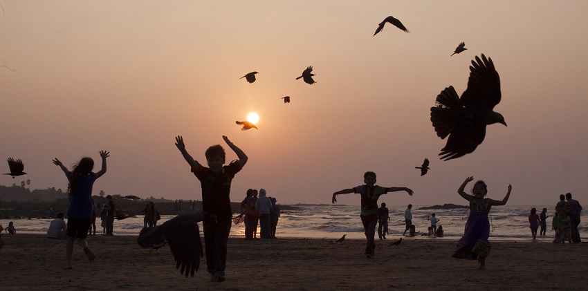Children playing at sunset on Madh Island, one of the popular destinations.