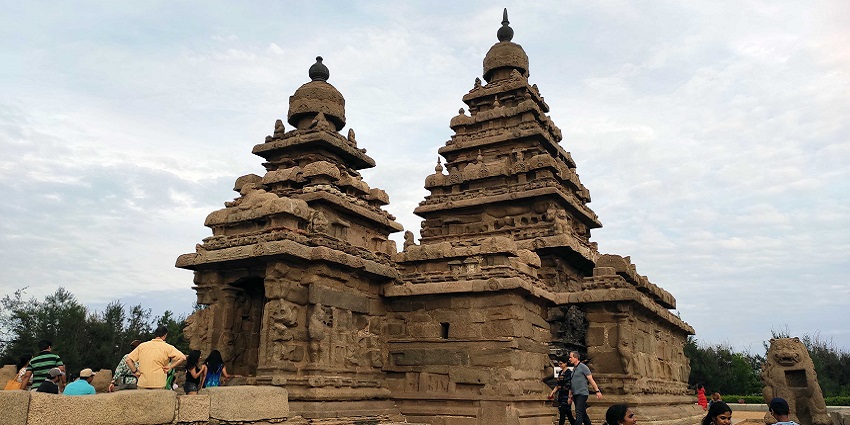Shore Temple in Mahabalipuram with tourists exploring the ancient stone architecture