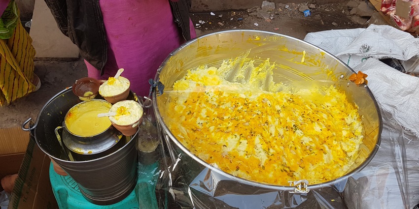 A vendor selling delicious Makhan Malai on the streets, the best food in Vrindavan