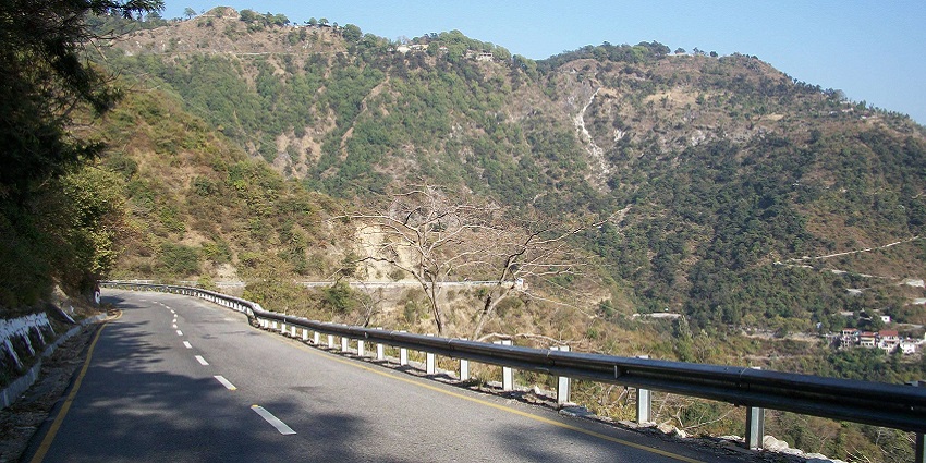 Picturesque road leading to serene camping spots and nature.
