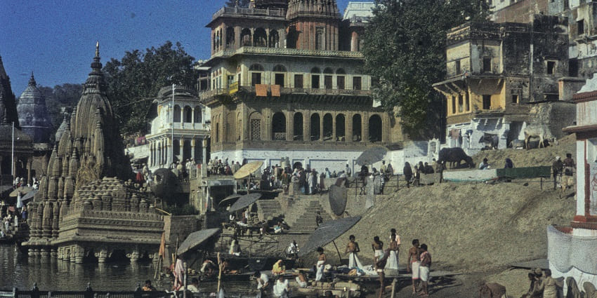 A view of Manikarnika Ghat, a tourist attraction near Funtasia Waterpark with ancient structures.