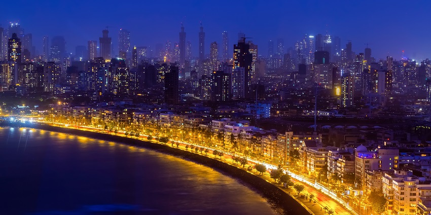 Marine Lines in Mumbai, showcasing the city’s skyline along the coastline with a vibrant sunset