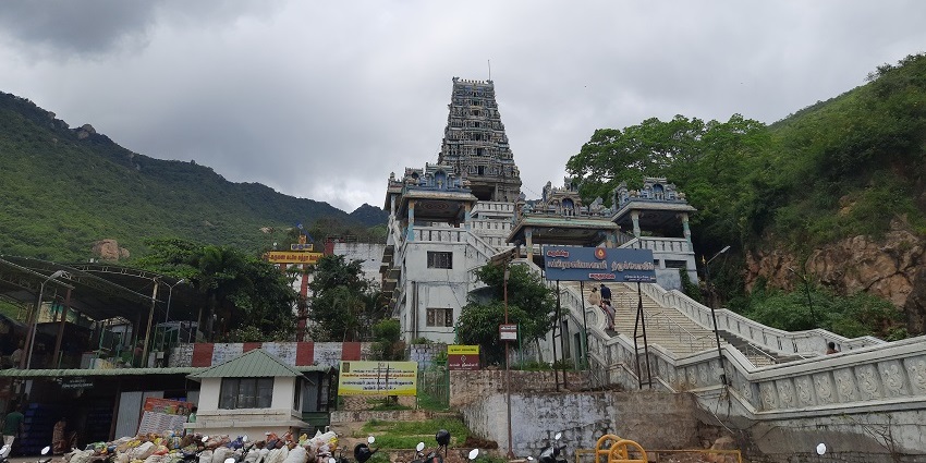 Marudhamalai Subramanya Swamy Temple set on a hill with steps leading to the temple.