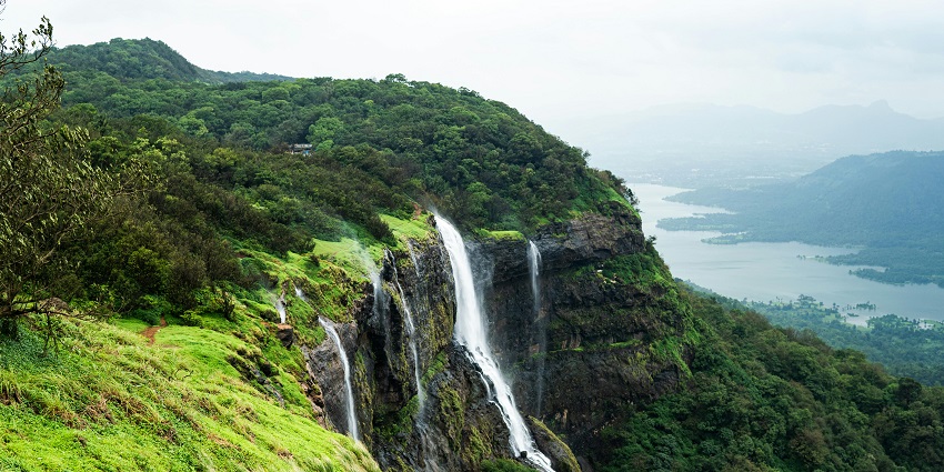 A picture of a scenic hill station in Maharashtra with a waterfall flowing down the hill
