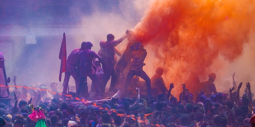 Playing Holi in Mathura during a festive weekend is a memorable moment.