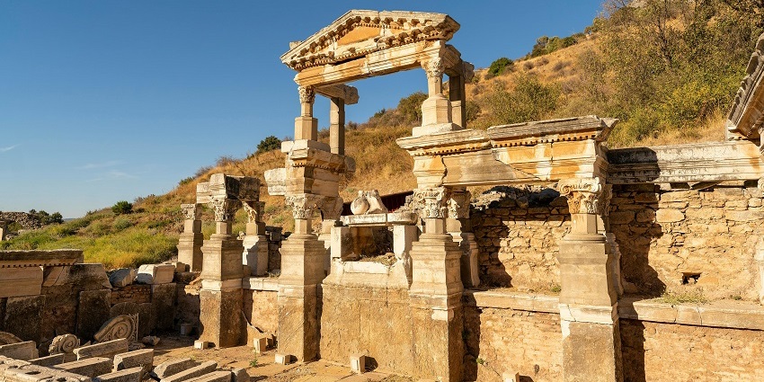 Ancient ruins showcasing weathered stone structures, reflecting the rich history and heritage of the site.