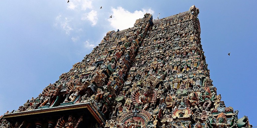 Meenakshi Amman Temple, South Gopuram, adorned with intricate work and vibrant sculptures.