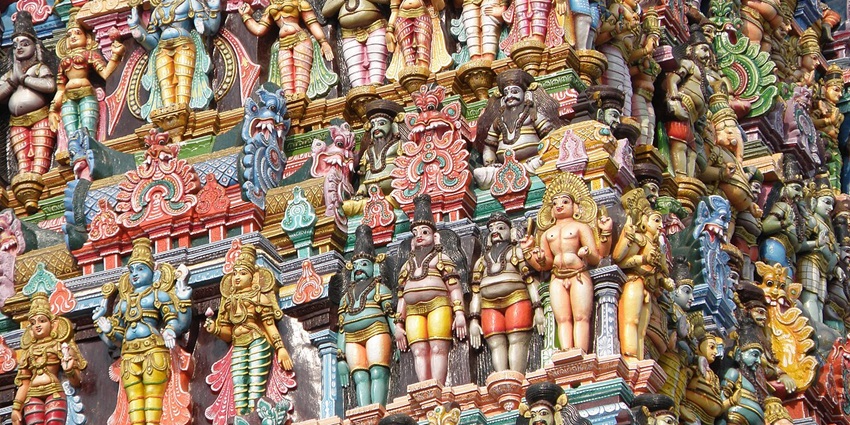 Ayyanar Temple view with colorful statues, traditional gopuram, and vibrant architectural details.