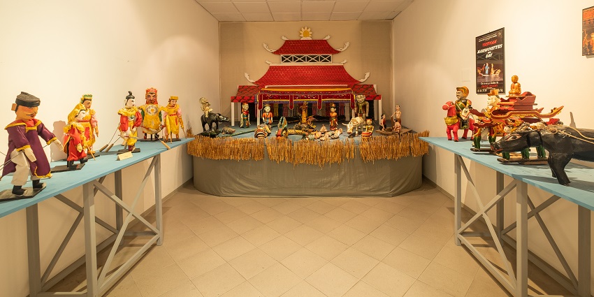 Vietnamese puppets on display at a Lonavala museum, showcasing traditional art forms.