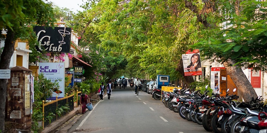 An image of a lively street in Pondicherry featuring shops, cafes, and vibrant local culture.