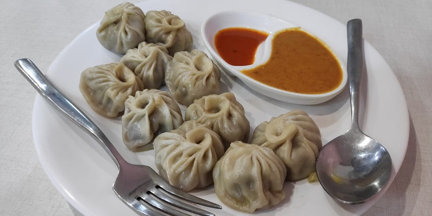 The best street food in Nainital is steamed dumplings filled with vegetables or meat, served hot.