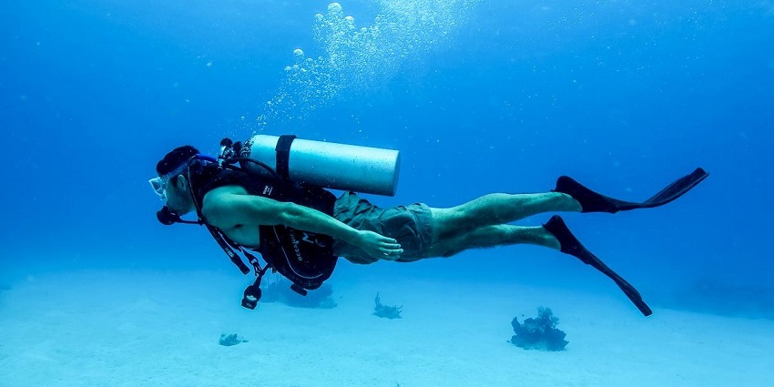 An image of a diver exploring the turquoise waters of Morya Beach
