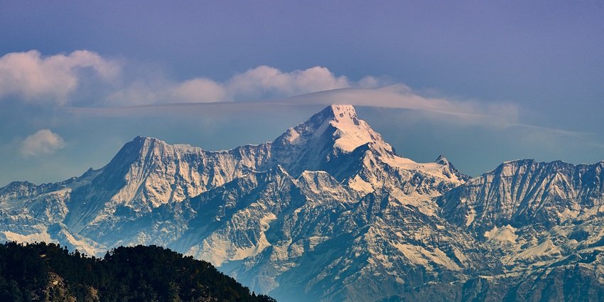 The sunset view from the snow-capped mountains of Mukteshawr looks beautiful.