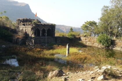 Scenic image of Mulher Fort, located in the Sahyadri mountain range, showing its old architecture.