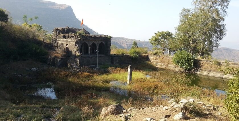 Scenic image of Mulher Fort, located in the Sahyadri mountain range, showing its old architecture.