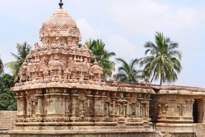 Muneeswaran Temple with intricate carvings, vibrant statues, and architectural details.