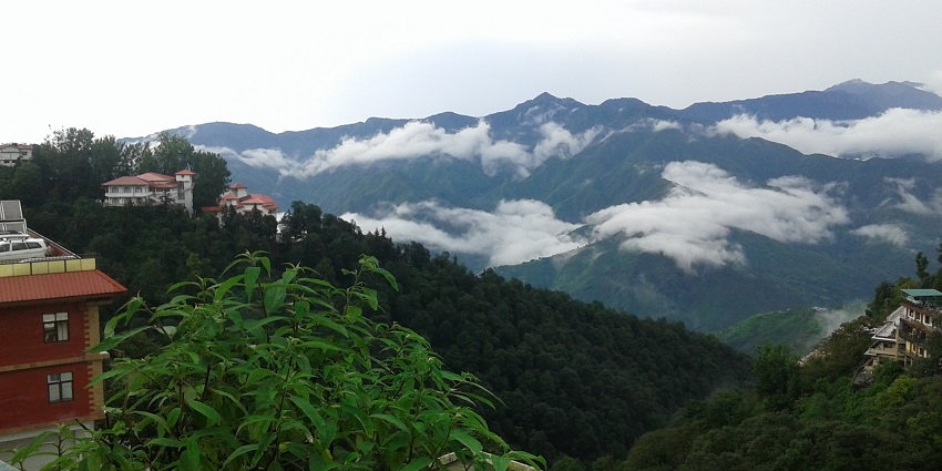 Hill station of Mussoorie with scenic views, green hills - places to visit in Uttarakhand in April.
