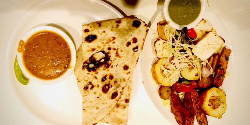Tender kebabs wrapped in naan are a flavorful highlight of the best foods in Meerut.