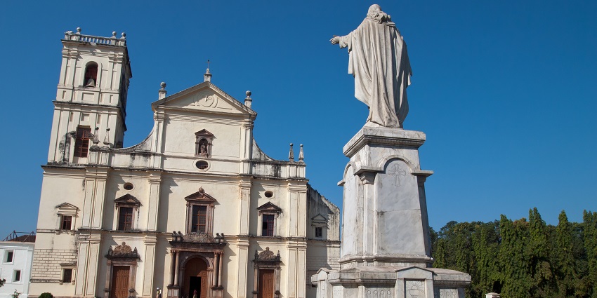 An image of a breathtaking low-angle view of the church's cross against the sky.