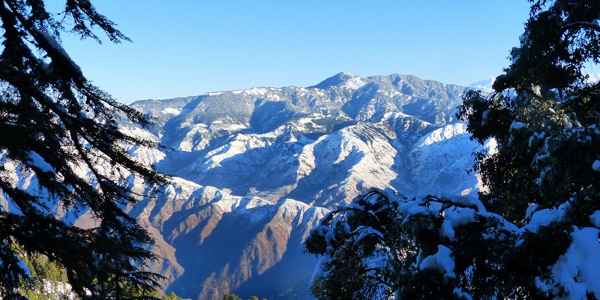 Trekking in Mussoorie offers panoramic views of snow-capped peaks.