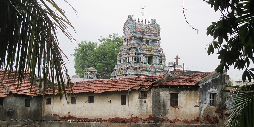 View of the detailed carvings on the gopuram of the Naganathaswamy Temple