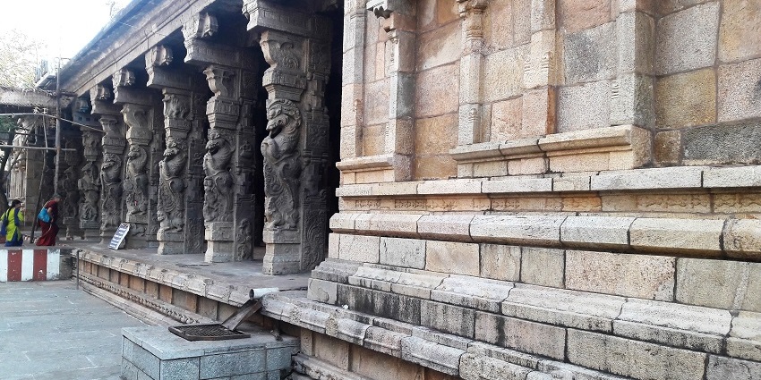 Structure of Thirunageswaram Temple with its intricately carved pillars and detailed walls.