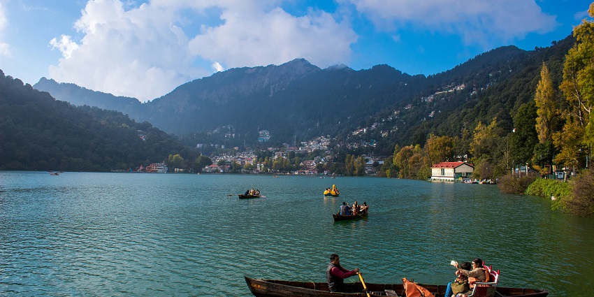 A beautiful view of Naini Lake, with glowing lights reflecting on the water in Nainital.