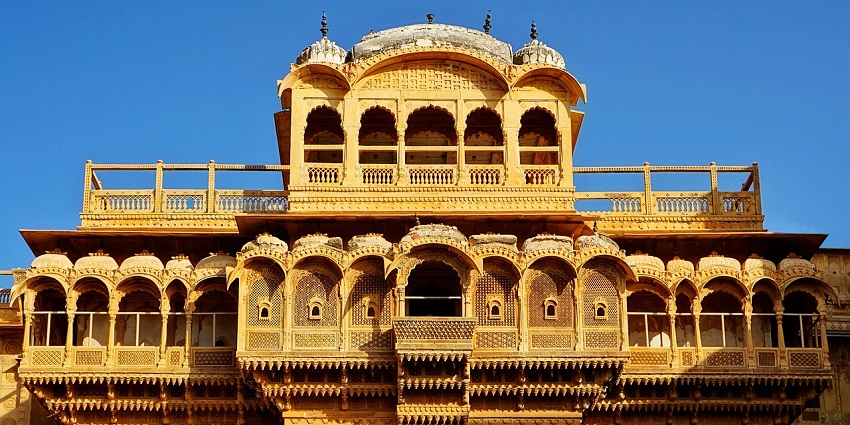 An image of Nanda Bhavan constructed of a golden lozenge, with fine carvings.