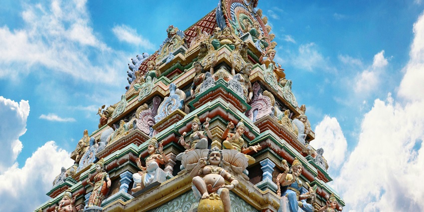 Image of an ancient temple with intricate carvings highlighting the Madurai temples.