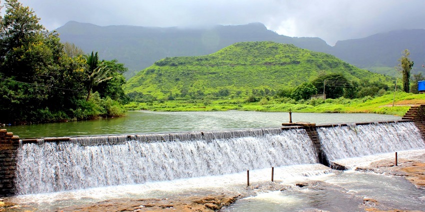 A view of Neral, a famous place near Mrugagad Fort, surrounded by overgrown greenery.
