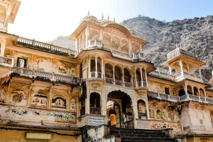 Devotees visiting Nidhivan Temple, featuring ornate carvings and a placid ambience.