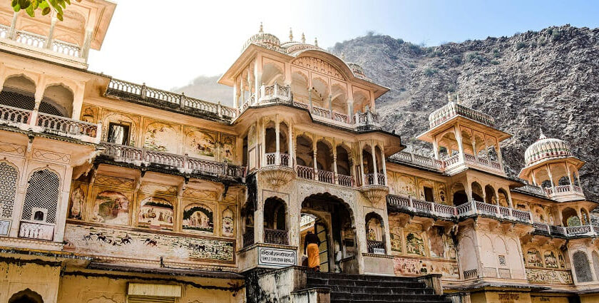 Devotees visiting Nidhivan Temple, featuring ornate carvings and a placid ambience.