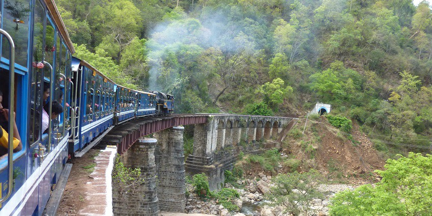 A vintage Nilgiri Mountain Railway train in one of the best places near Mukurthi National Park.