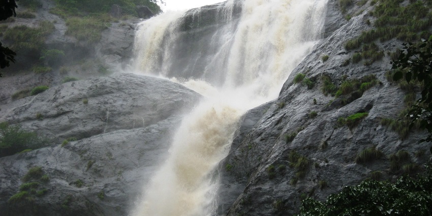 An image of Old Falls over rocky terrain, a tourist attraction near Courtallam Waterfalls.