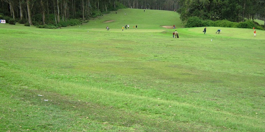The Ooty Golf Course with green fairways stretching across the hills of the Nilgiris