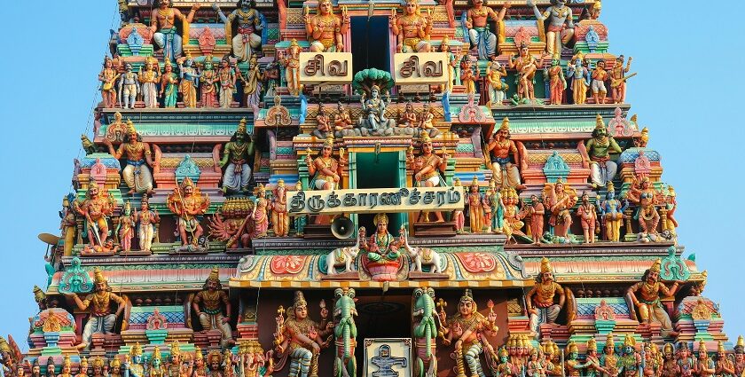 Close-up of the Intricate statues of Hindu gods adorning the colourful temple wall