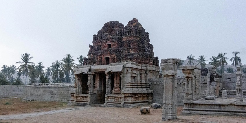 Ruins of Kapaleeswarar temple in India, featuring intricate stone carvings.