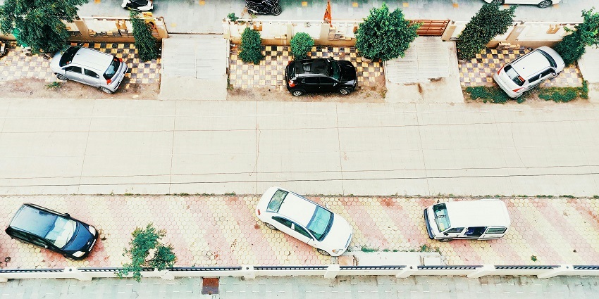 An aerial view of a large car parking near Aligarh Fort offering a big parking space.