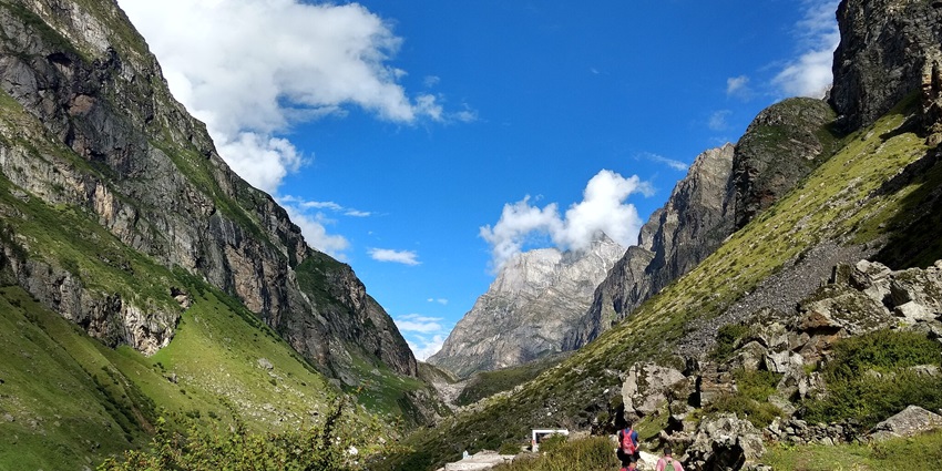 The trekking route to the Vasundhara Waterfalls surrounded by dry cold hills