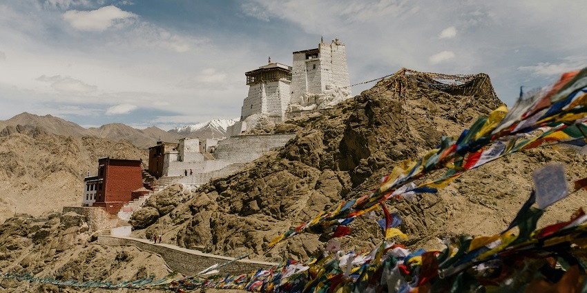 Stunning image of a Buddhist gompa built on the hills of the Himalayan mountain ranges
