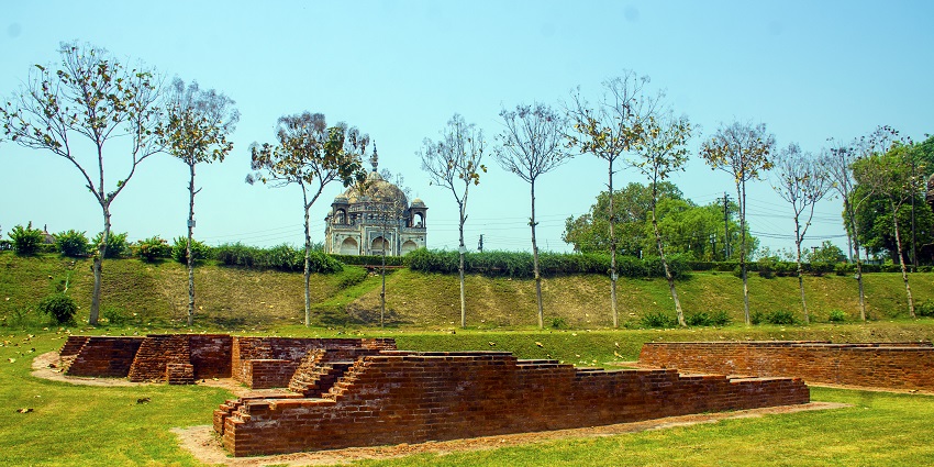 A serene view of the Rajghat in Varanasi, India, featuring the Ganges River.