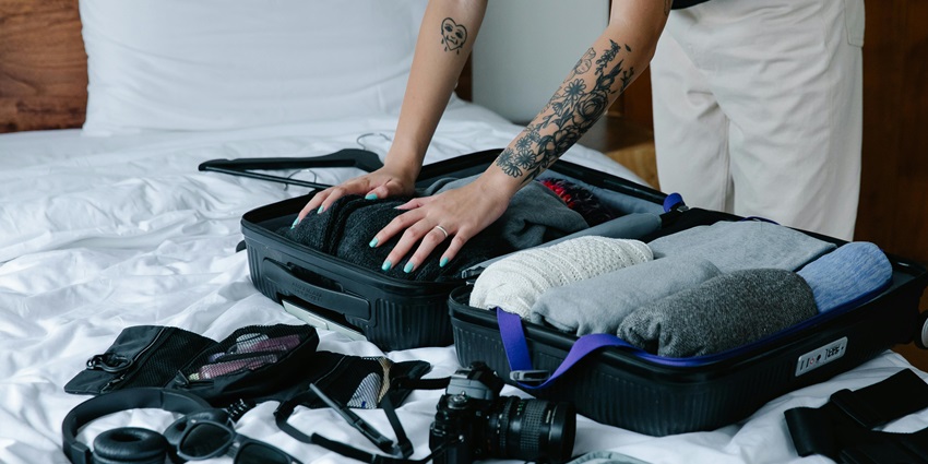 An image of a person packing his things for his trip to the famous temples of Kanpur.