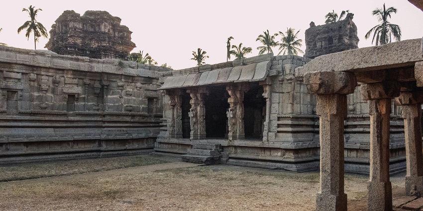 An Indian temple adorned with stone carvings features sculptures and architectural elements