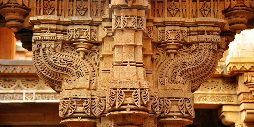 Intricate temple architecture with ornate carvings, showcasing traditional design elements.