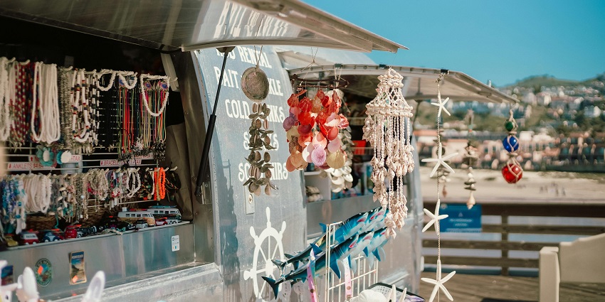 Close-up of a neatly organised accessory store display with various handmade things.